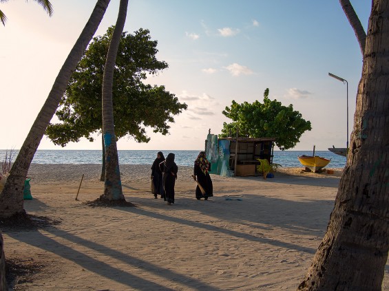 Women  sweeping the streets of Maafushi