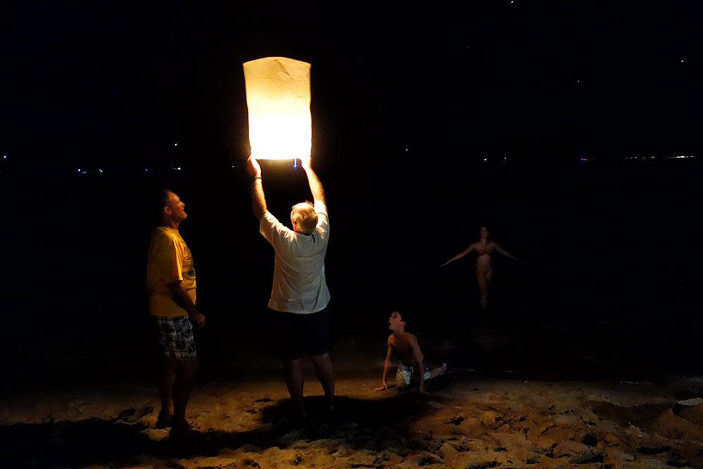 Keith of Poco Andante lights a lantern on New Year's Eve