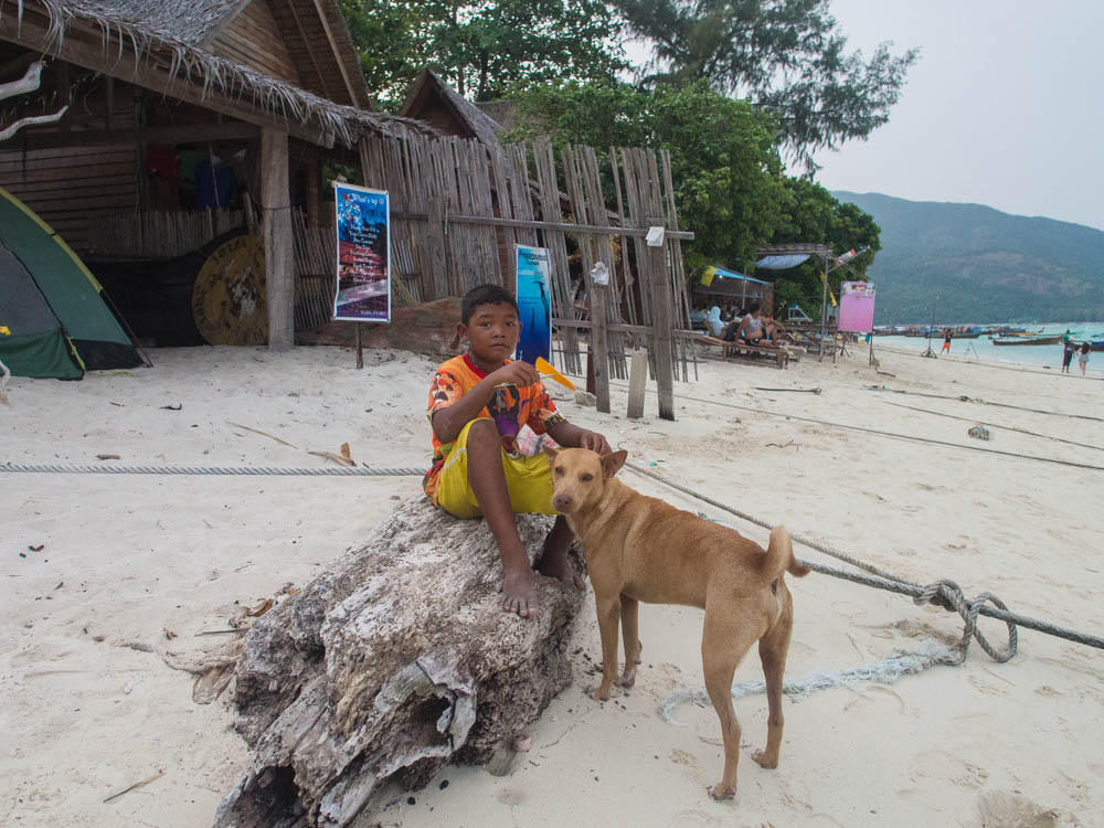One lad and his dog on Ko Lipe