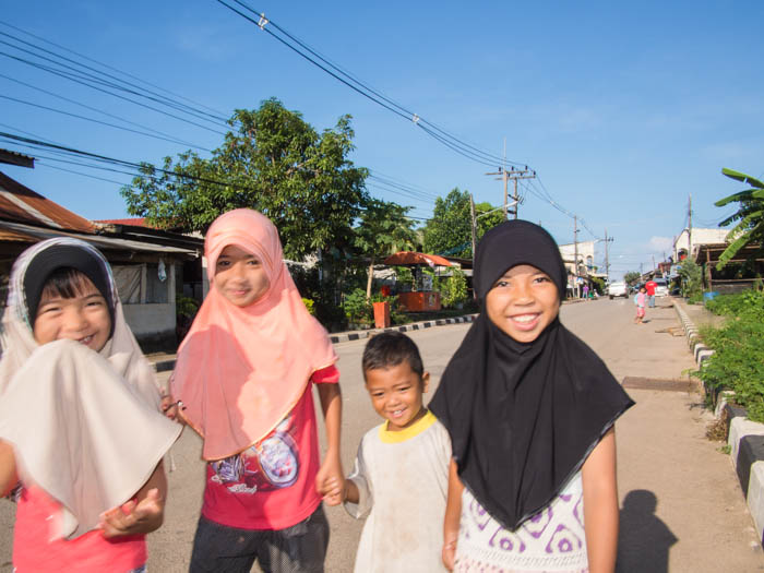 More young people, this time local children on their way to the market