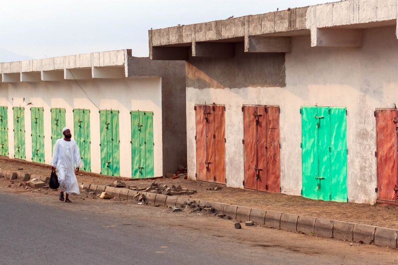 man walking down a side street, port sudan