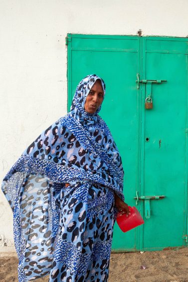 muslim lady in bright clothing
