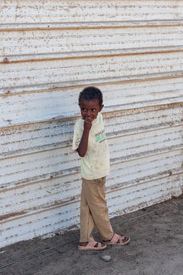 Boy by wall, Sudan