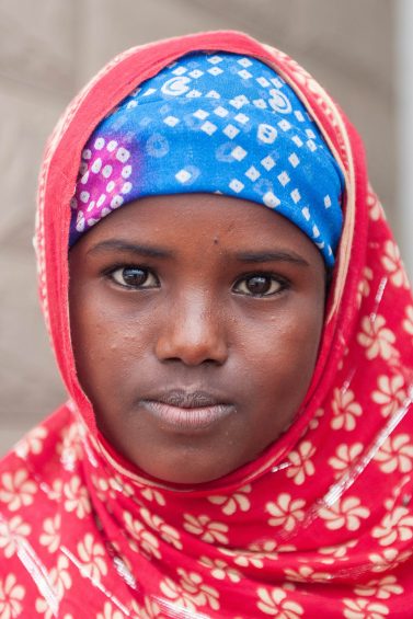 An ethiopian refugee in Massawa in red