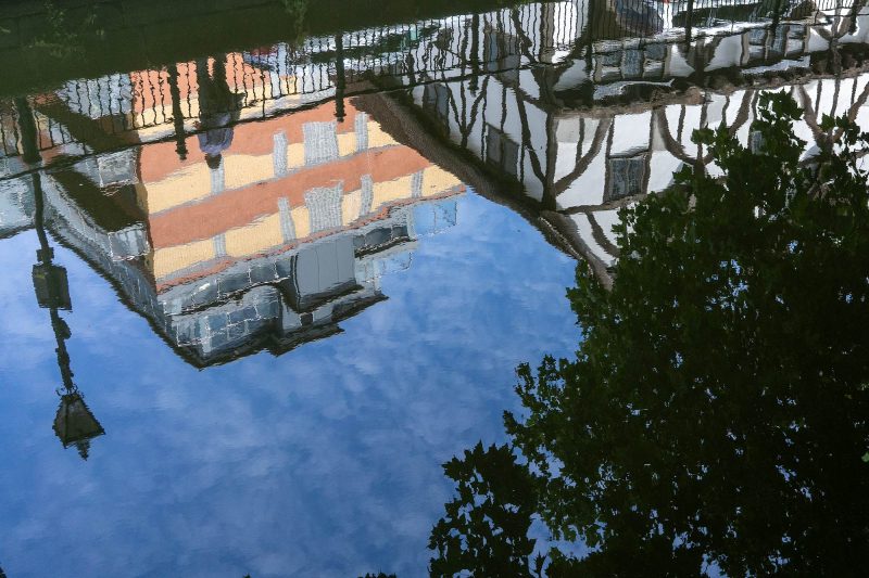 The River Witham reflects modern and ancient architecture